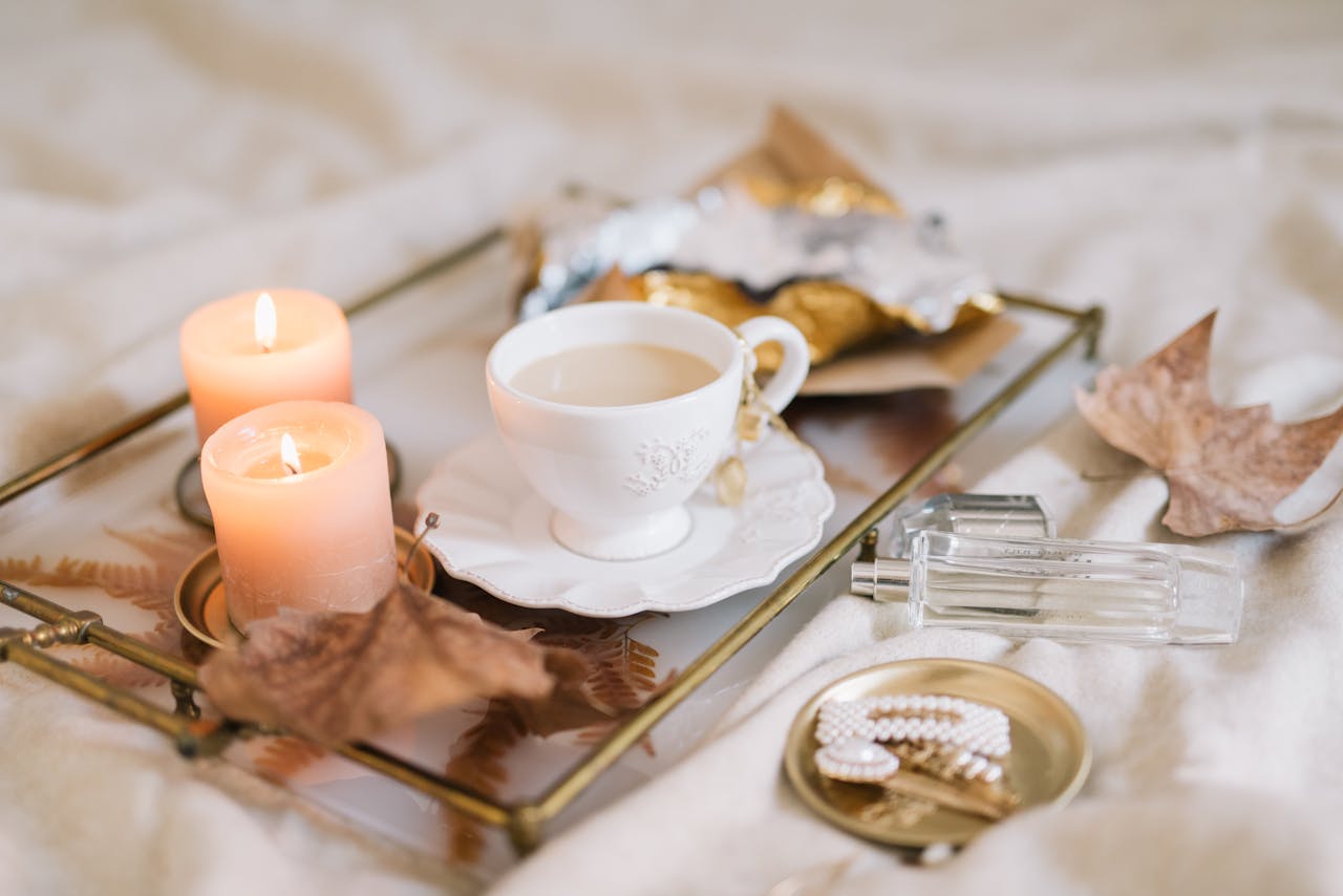 ours-journey Enjoy a relaxing autumn morning ambiance with tea, candles, and cozy decor.